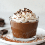sugar free chocolate pudding served in clear glass cup with whipped cream