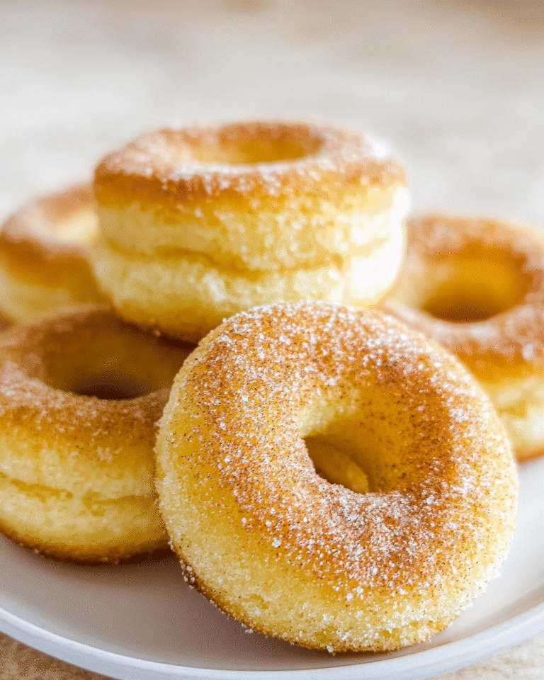 sugar free donuts on ceramic plate with cinnamon in cozy kitchen