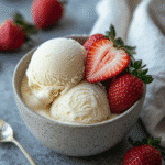 creamy sugar free frozen yogurt with strawberries in ceramic bowl